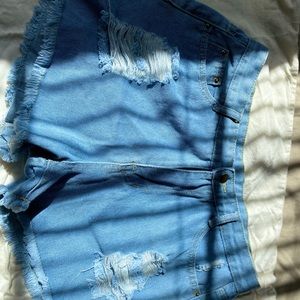 Distressed frayed denim shorts